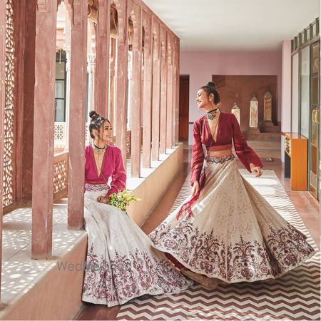 Photo of Bride's friends twirling in this beautiful lehenga .