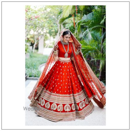 Photo of A beautiful portrait of twirling bride.