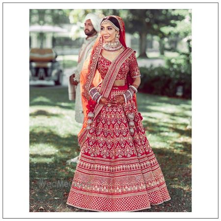 Photo of A beautiful bride of Sabyasachi in statement red lehenga .