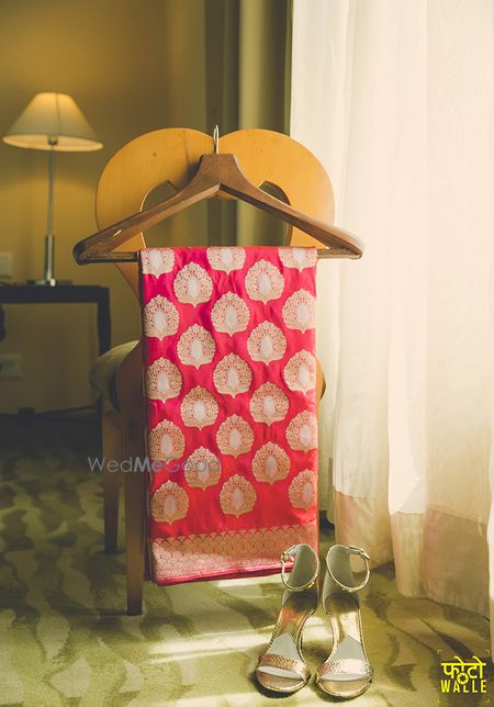 Photo of Red and Gold Hanging Saree with Silver Heels