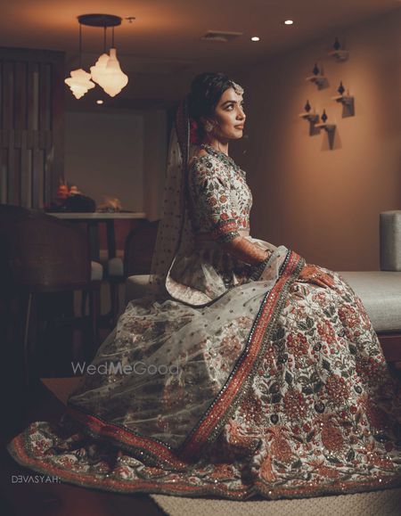 Photo of Shot of a bride dressed in white lehenga