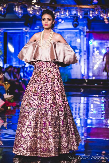 Photo of Purple Lehenga with Gold embroidery and Thread Work