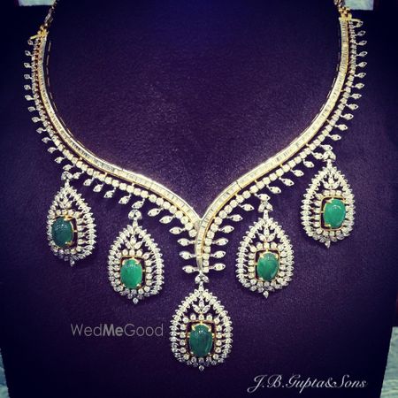 Photo of diamonds and emerald necklace with oval emerald drops