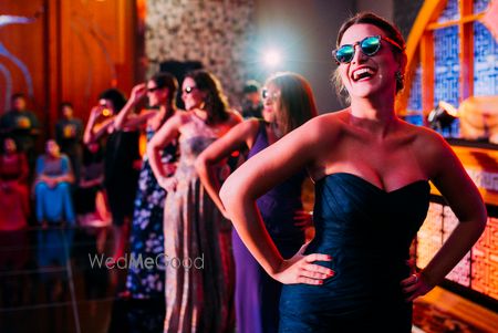 Photo of Fun Bridesmaids Photo Onstage During Sangeet