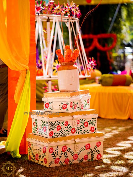 Photo of Hand-painted trunks and mason jar used in Mehendi decor.