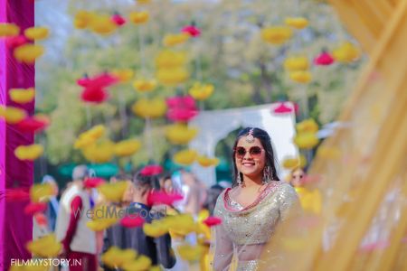 Photo of fun mehendi photo with bride in silver lehenga