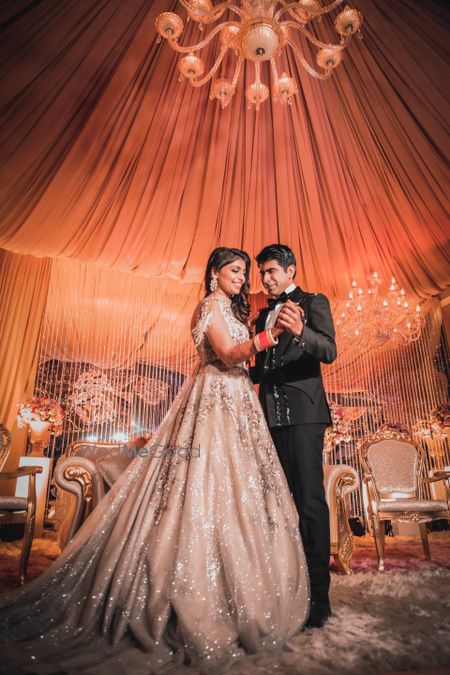 Photo of Bride & Groom dressed in silver and black for their reception ceremony.