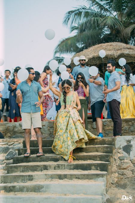 Photo of Couple entry with squad holding balloons