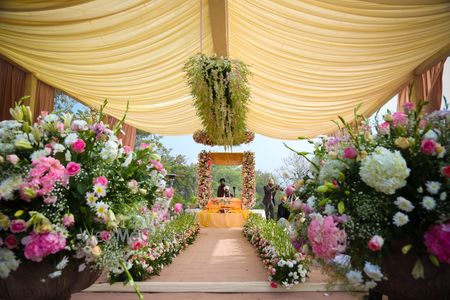 Photo of Entry walkway decorated with flowers on either side.