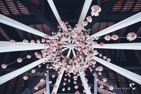 Photo of Ceiling decorated with a bunch of flowers.