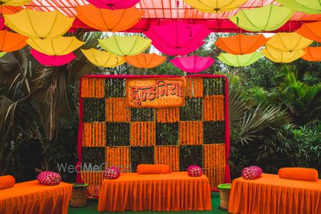 Photo of Colorful mehendi decor with umbrellas