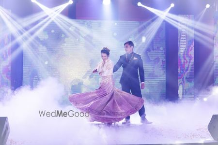 Photo of Bride and Groom Romantic Dance Onstage