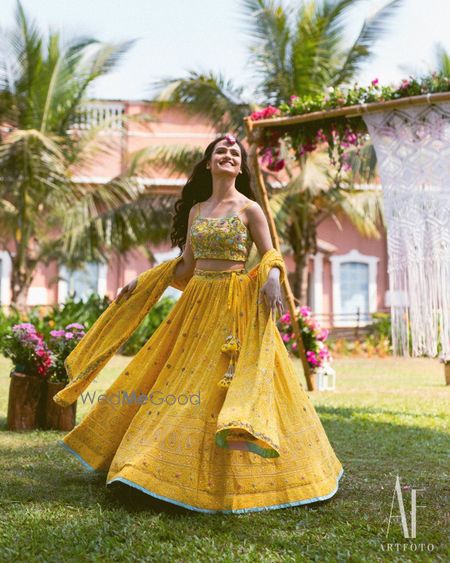 Photo of Pretty bride twirling on her mehendi