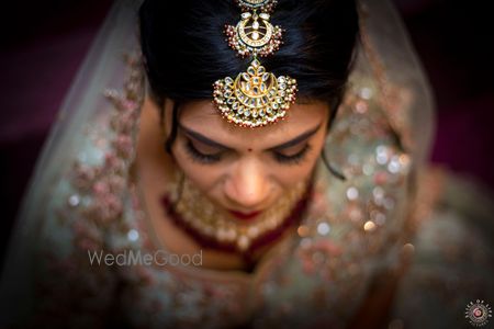 Photo of A bridal mang tikka with chandbaalis.