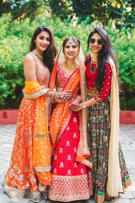 Photo of Bride posing with bridesmaids.