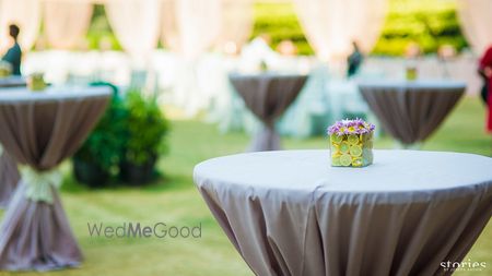 Photo of grey cocktail table setting with stand up tall tables