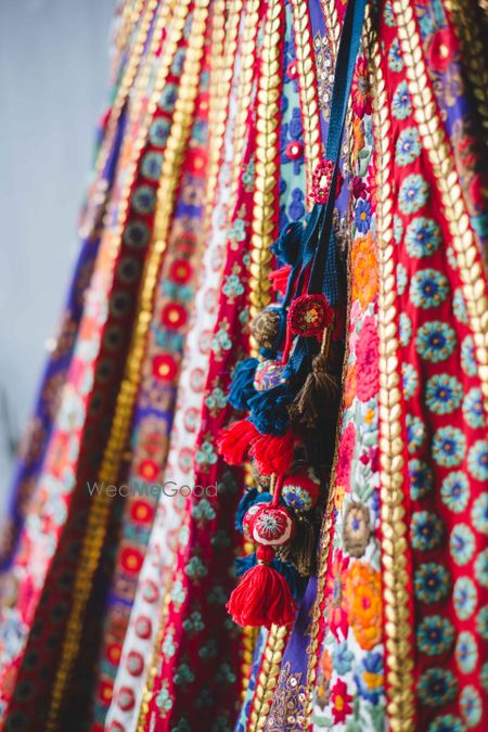 Photo of Red and blue threadwork lehenga