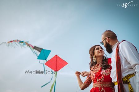 Photo of Bride and groom flying kites on their mehendi.