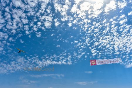 Photo of Airplane with bride and groom banner