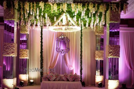 Photo of pastel white banquet decor with ferns